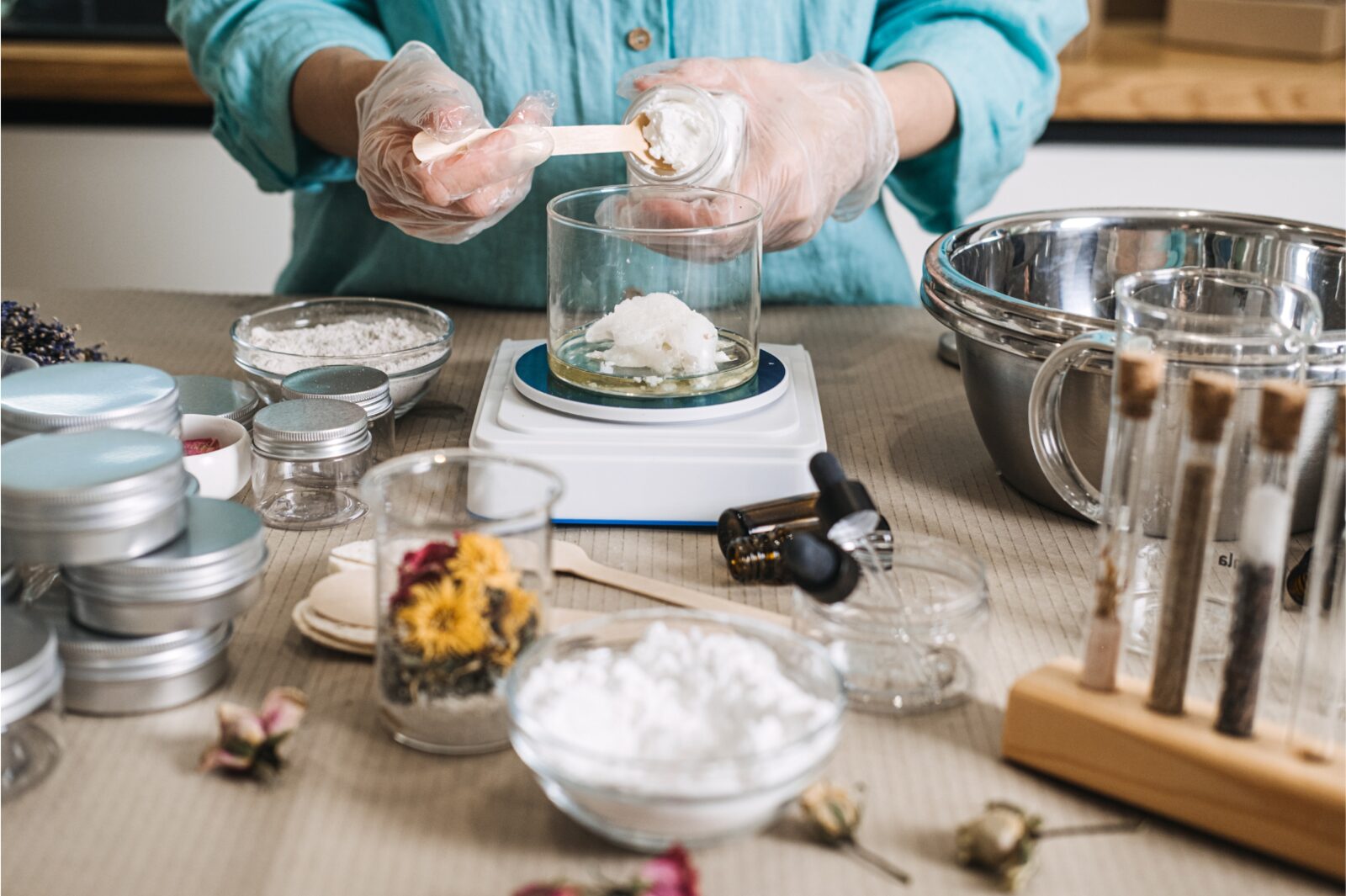 Formulating a cosmetic product by hand at a lab bench