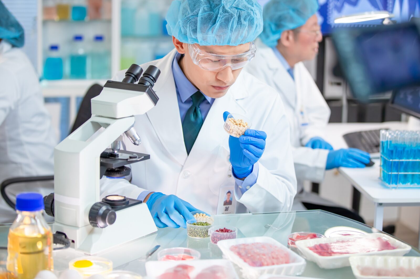 Food scientists inspecting samples in a food R&D lab
